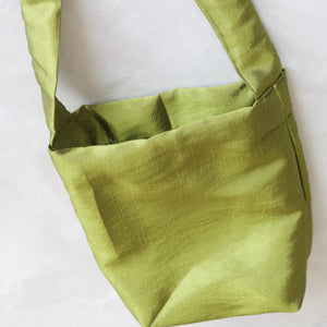 Bronwen x YV green satin pouch bag